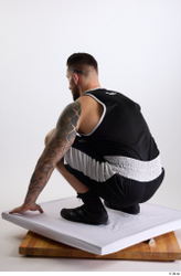 Whole Body Man White Sports Shorts Slim Athletic Kneeling Top Studio photo references